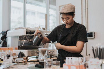 Asian woman Barista using coffee machine in coffee shop. female barista wearing medical face mask working in coffee cafe.