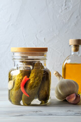 Pickled cucumbers in a jar.