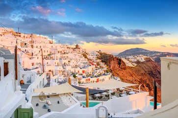 Fantastic sunset on famous view over greek resort Fira, Greece, Europe. luxury travel. famous travel landscape. Summer holidays. Travel concept background.