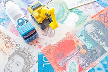 digger and concrete mixer truck and banknotes
