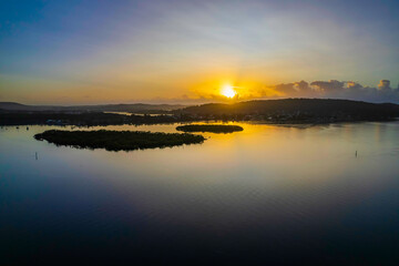 Hazy Sunrise Waterscape with Reflections
