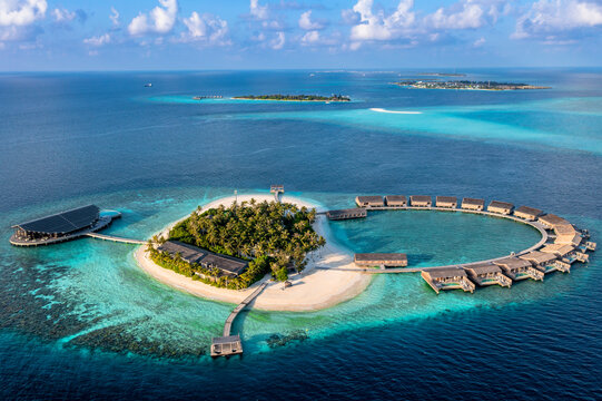 Aerial view of bungalows surrounded by blue sea at Kudadoo island, Maldives
