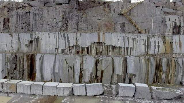 Slow camera dolly of granite quarry stone slabs