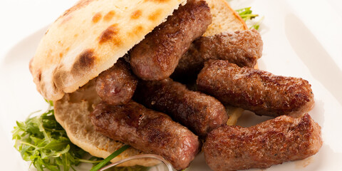 photo of Cevapi, cevapcici, traditional  Balkan food - delicius minced meat - banner size