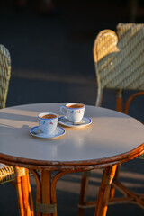 Two cups of espresso coffee on a coffee shop terrace from Paris, France.