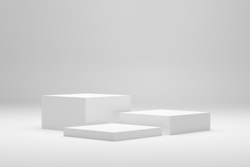 Blank white podium platforms or pedestals with white background for product display. Empty stands...