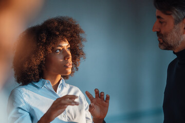 Businesswoman discussing with colleague at work place