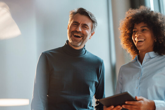 Cheerful business colleagues in office