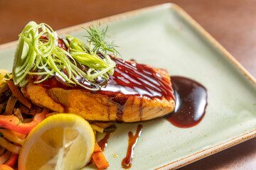Smoked salmon served with vegetables and soy sauce