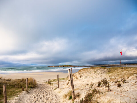 Cloudy sky overPointe de la Torcheheadland beach