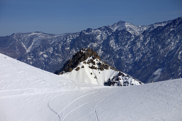 Trace from ski and snowboards on off-piste slope