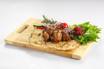 Pork meat shashlik served salad