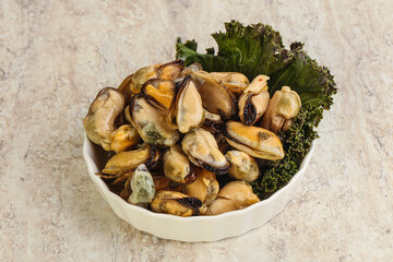 Tasty marinated mussels in the bowl