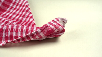 Folded kitchen textile towels of different colors, Household cleaning cloth. Closeup of cleaning rag isolated on a white background.
