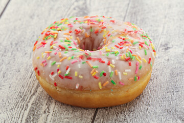 Sweet glazed vanilla donut with icing