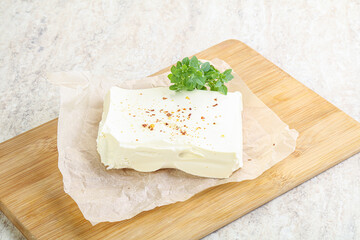 Greek Feta cheese over board