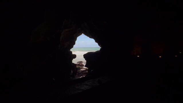 Sea view from the inside of a dark cave