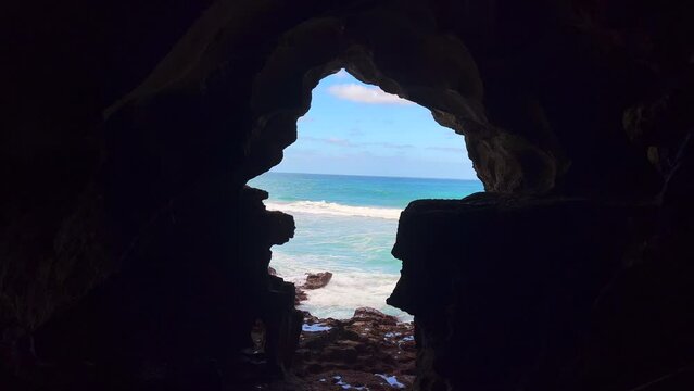 Sea view from the inside of a dark cave