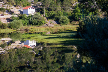 small house on the lake wtih wonderful reflection