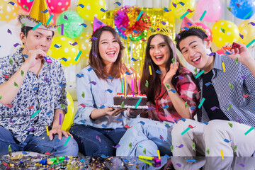 Group of happy people celebrate birthday at home