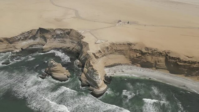 Aerial tilt reveals expansive Chala desert sand on Peruvian coast