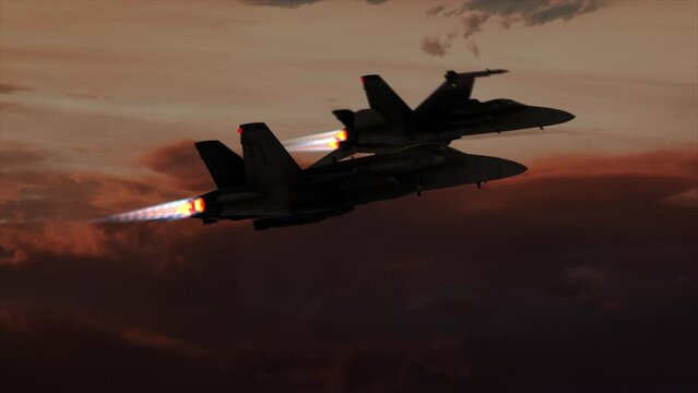 4K Aerial two F18 Hornet flying at sunset and rolling left