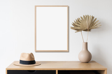 Blank vertical frame mockup on white wall. Artwork template in minimal interior design. View of modern style interior with canvas for painting or poster on wall. Minimalism and summer concept