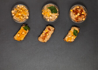 Homemade vegan appetizer hummus paste with flavouring top view