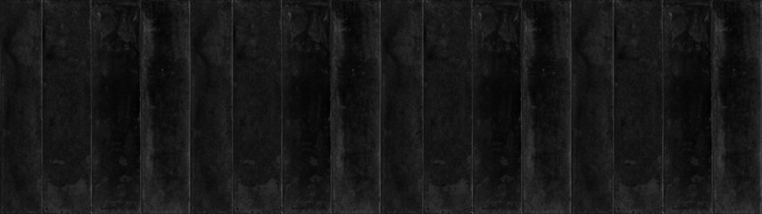 Dark black anthracite rectangular rustic concrete cement brick tiles wall or floor texture wide background banner panorama