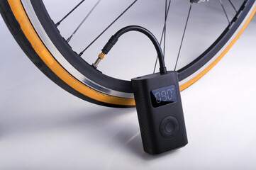 Portable cordless tire inflator © NUTTANART