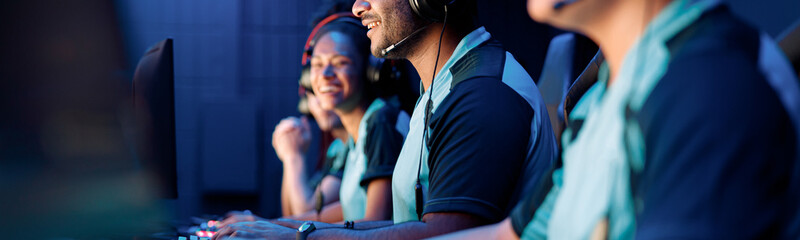 Selective focus on African esports player participating in online video games competition with...
