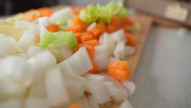 Fresh chopped vegetables carrots, onions, potatoes, celery for a healthy and delicious. Close-up.