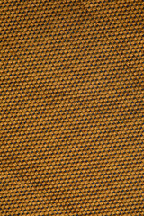 fabric in mustard color with geometric patterns. mustard knitted texture, background knitted mustard color