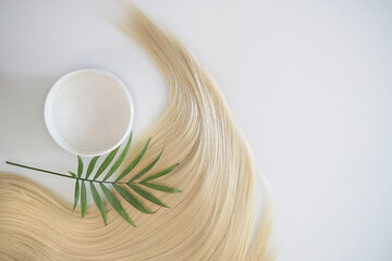 blonde female hair, balm or hair mask isolated on white background. Concept hairdresser spa salon....