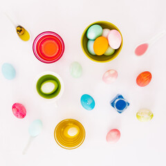 Top view of colorful easter eggs on white background