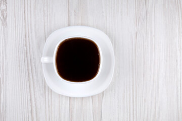 Coffee. White cup with coffee, top view