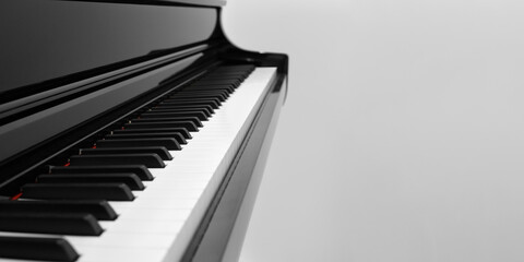 Close-up side view of piano keys with copy space.