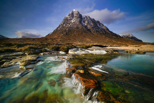 The Buachaille Etive mor mountain and the river Coupall located in Glencoe, Highlands Scotland.
