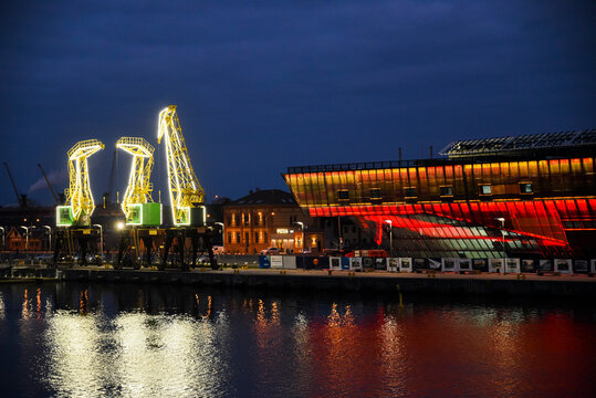 Szczecin, Poland, March 6 2022: Maritime science center in Szczecin on the chrobry embankment next to cranes.