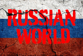 Flag of Russia painted on a concrete wall with words russian world.