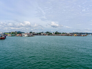 The seaport city and the beautiful blue sea and clear sky.