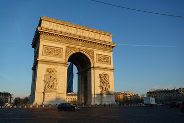 Fototapeta na wymiar Arch of Triumph building from Paris, France, during a beautiful spring sunrise. Photo taken from Champs Elysee boulevard. Landmarks of France.