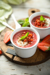 Homemade strawberry soup with chocolate and cream
