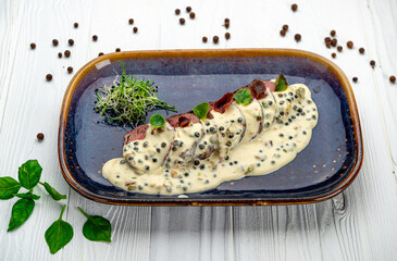 Roast fillet beef meat steak with peppercorn sauce