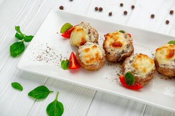 Stuffed champignons baked with cheese.