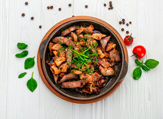 Meat and vegetables in frying pan