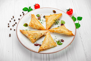 Fresh pies with meat and sesame seeds