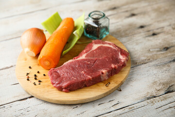 Beef broth ingredients on a wooden desk