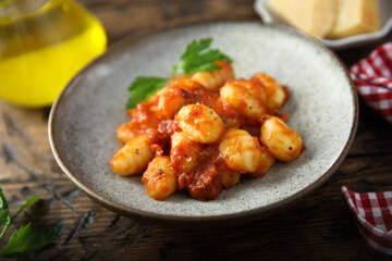 Homemade gnocchi with tomato sauce and cheese