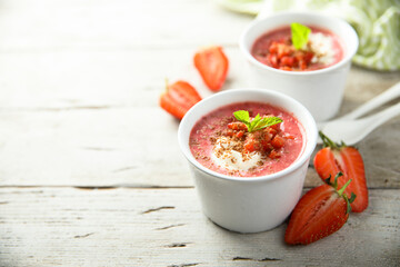 Homemade strawberry soup with chocolate and cream